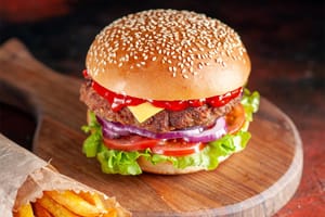 Front View Yummy Meat Cheeseburger With French Fries on Dark Background Salad Dinner Burger Snack Fast Food Sandwich Dish Toast